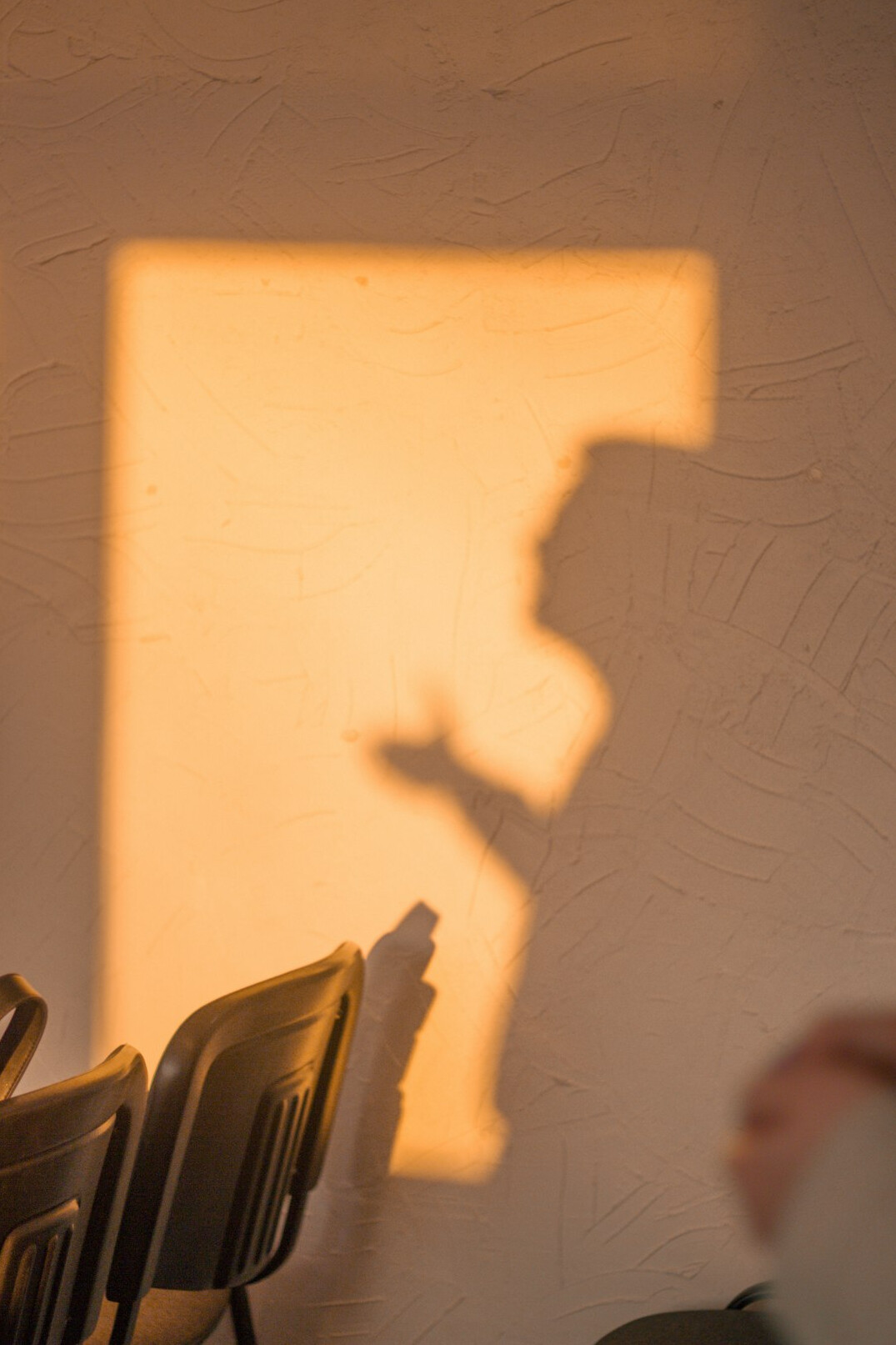 dark human shadow on wall